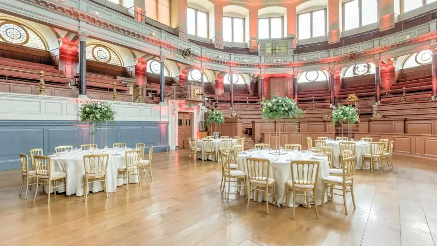 Photo of the Sheldonian Theatre with tables set up for a wedding